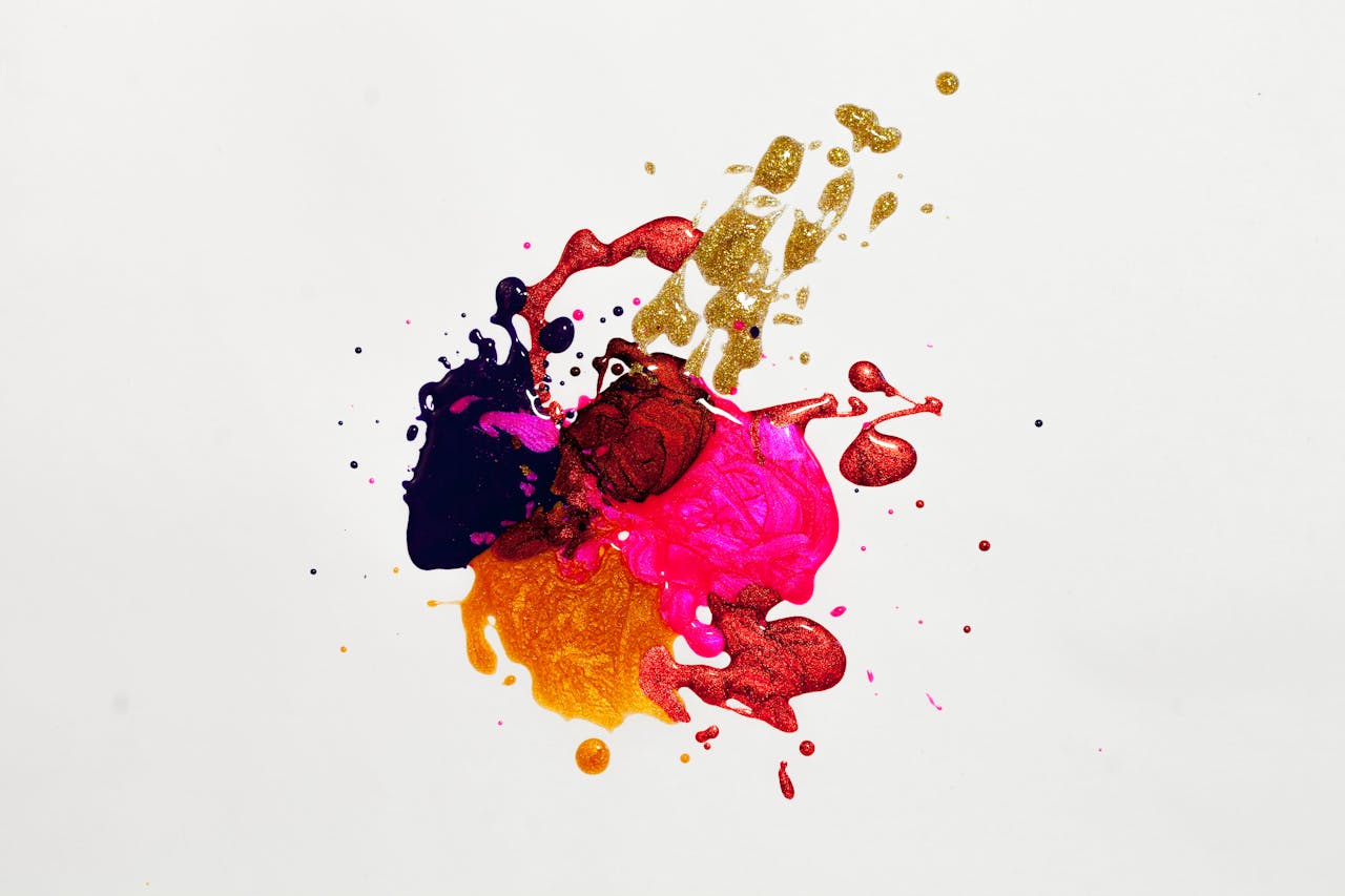 about-01 Colorful abstract paint splash on white background, capturing creative expression.